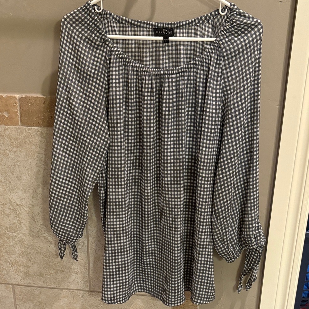 This is a Fred David grey-and-white gingham off-the-shoulder blouse